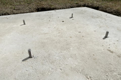 Studs inserted in concrete pad